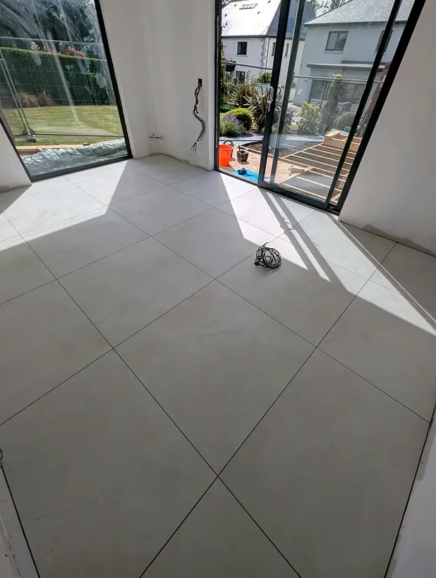 Large format floor tiles in a bright room