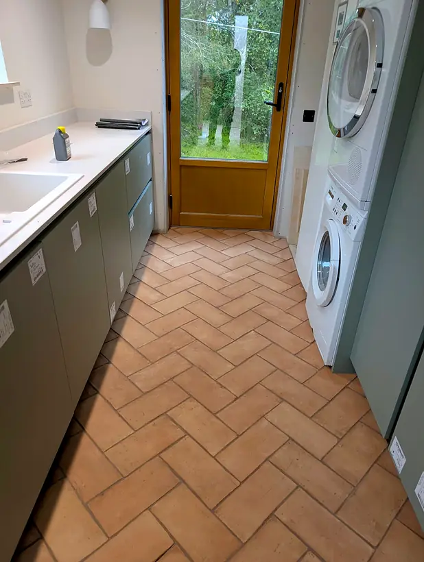 Terracotta herringbone utility floor